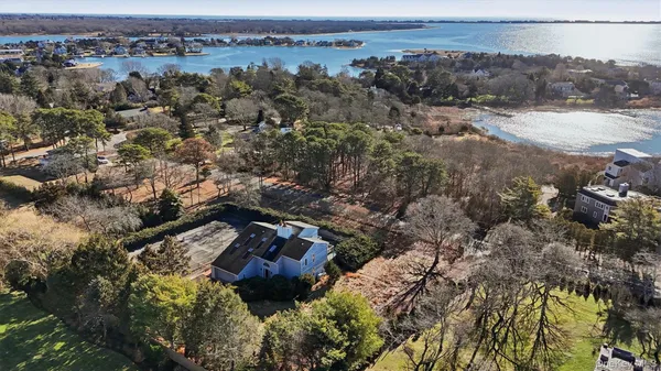 an aerial view of residential house with green space