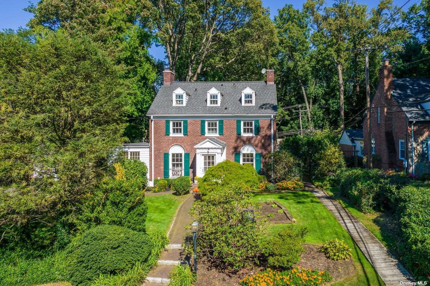 51 Longview Road Port Washington, NY 11050 - Photo 1 of 1 a front view of a house with a yard