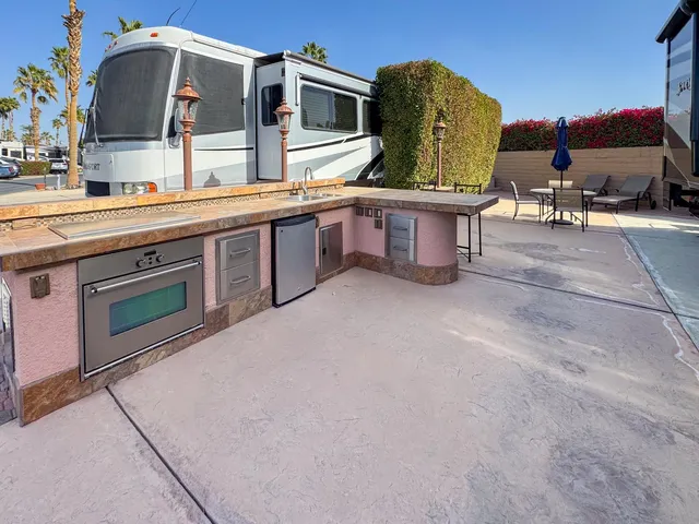 a view of a kitchen with furniture and stove