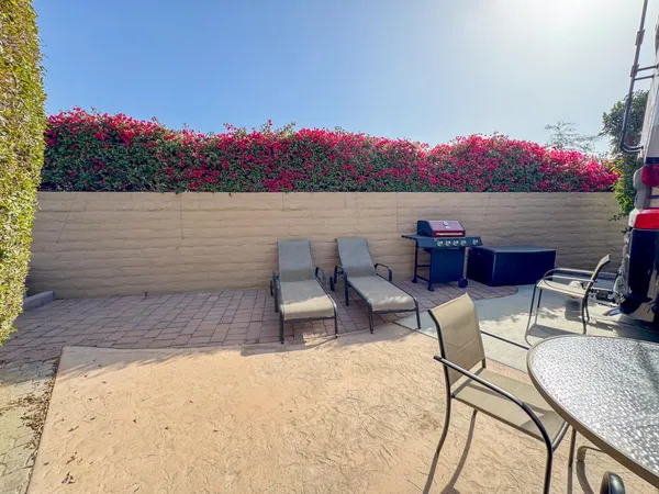 a view of a terrace with furniture