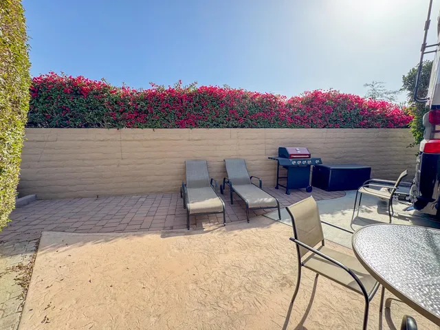 a view of a terrace with furniture