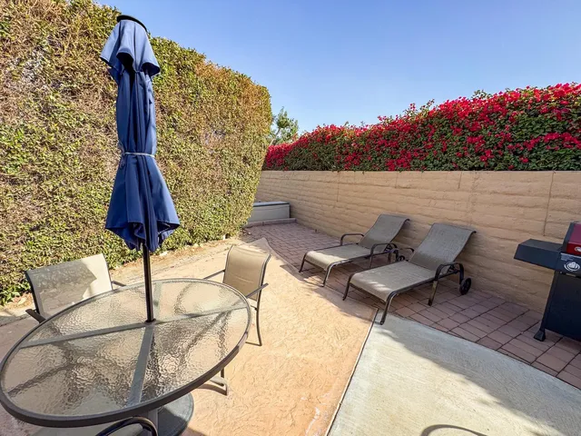 a terrace of a house with outdoor seating