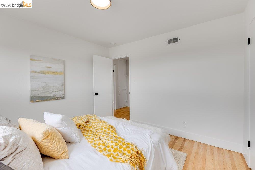1298 Ribbon Street Foster City, CA 94404 - Photo 57 of 86 Bright room with light wood-finish flooring, white walls, and white trim