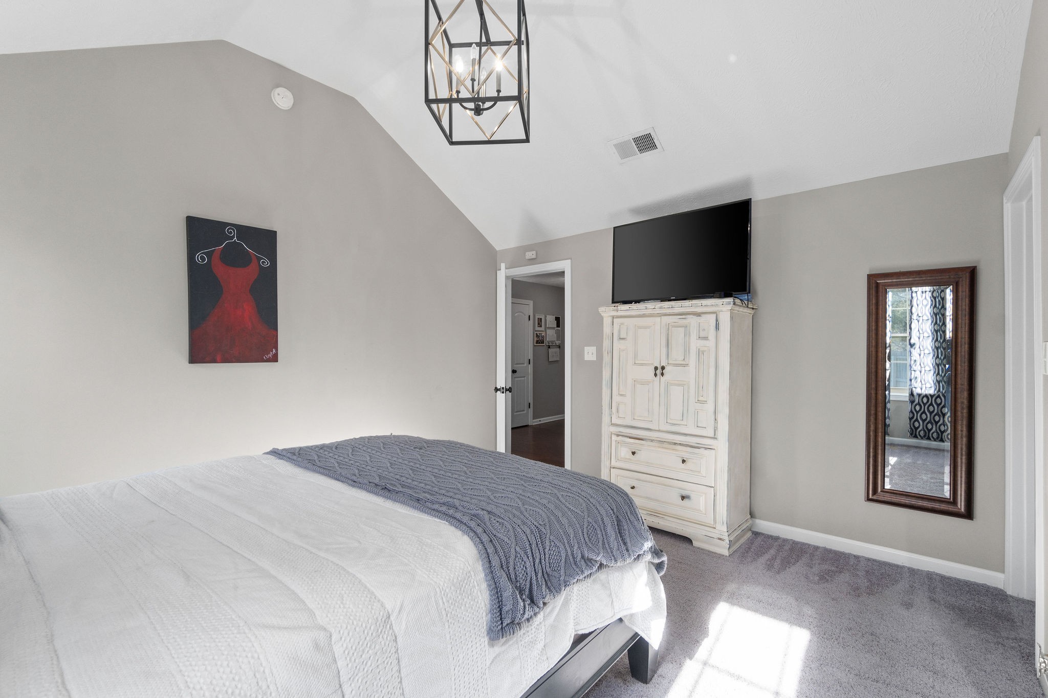 2344 River Road Clarksville, TN 37040 - Photo 25 of 37 a bedroom with a large bed and a flat screen tv