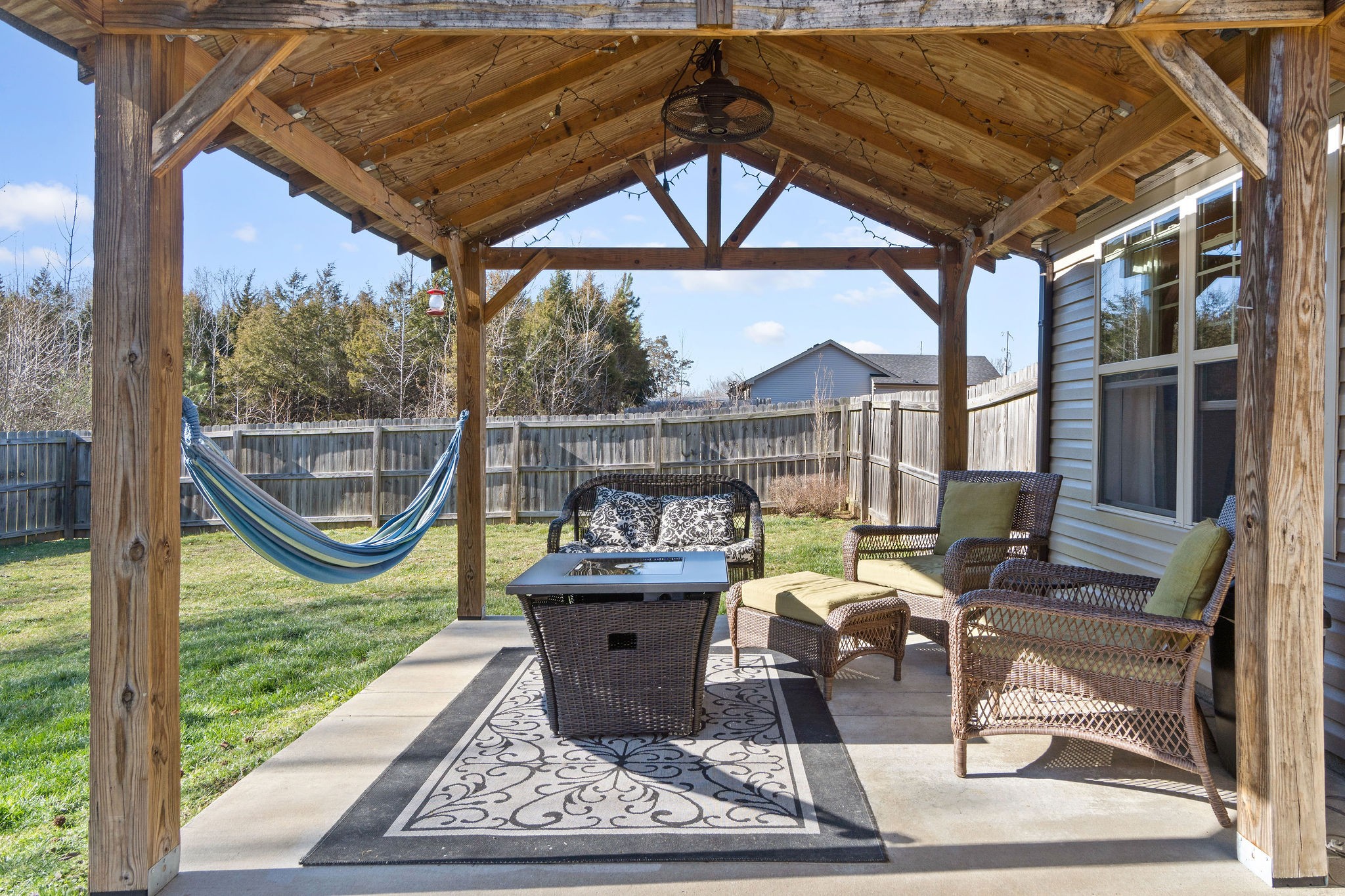 2344 River Road Clarksville, TN 37040 - Photo 33 of 37 a view of a patio with table and chairs potted plants with wooden floor and fence
