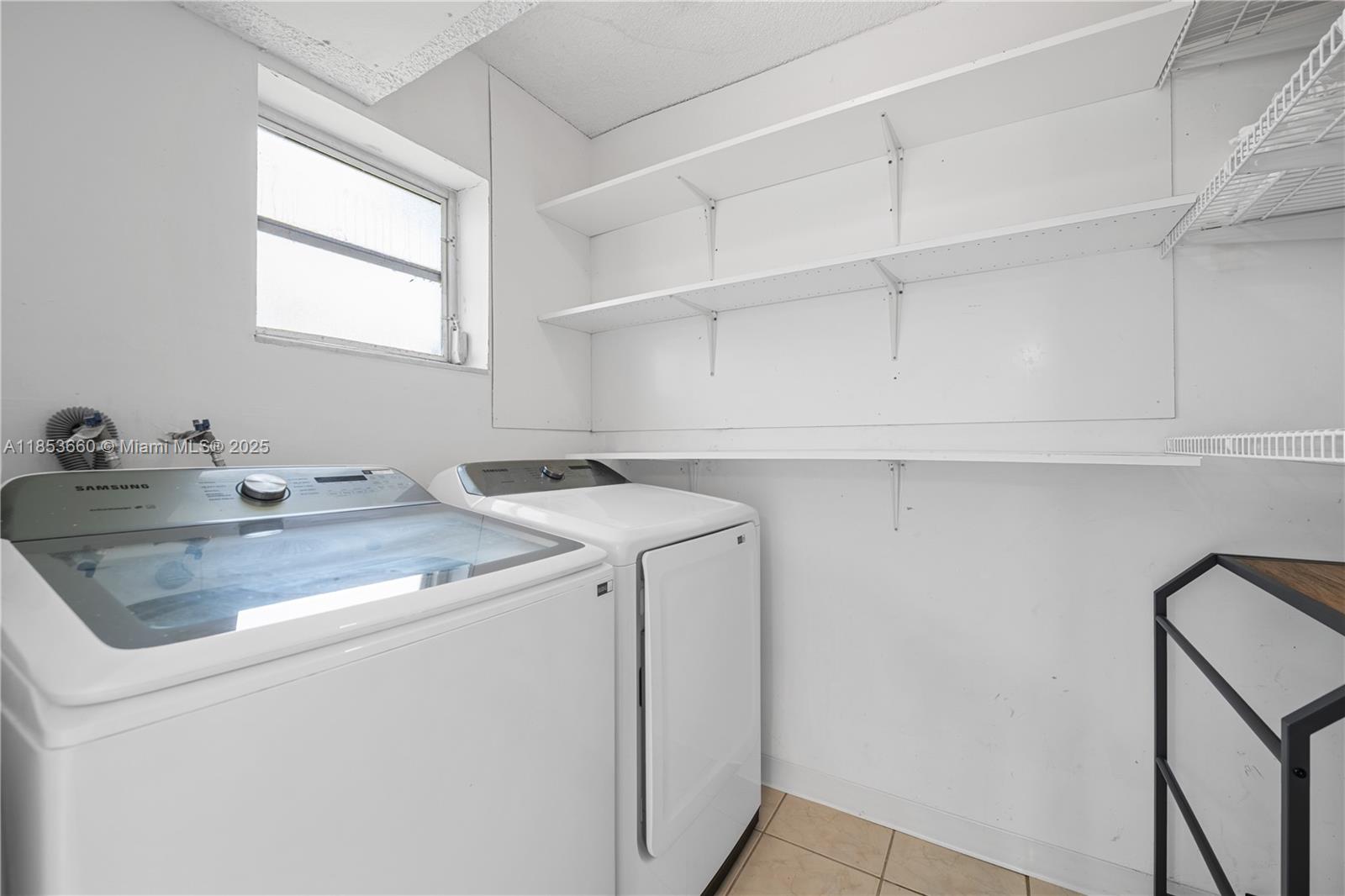4088 Inverrary Drive, Unit 11F Lauderhill, FL 33319 - Photo 15 of 34 a utility room with sink dryer and washer