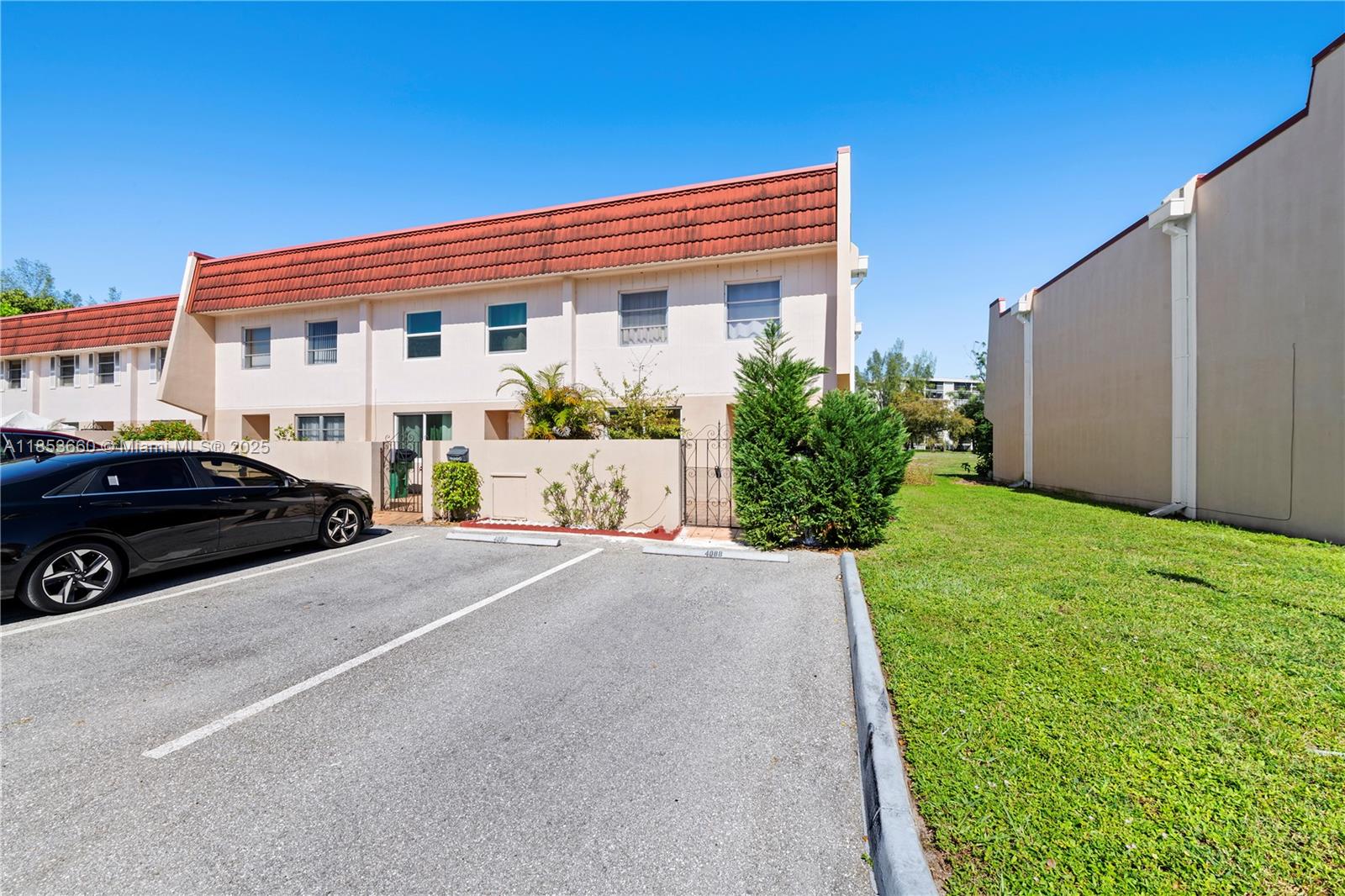 4088 Inverrary Drive, Unit 11F Lauderhill, FL 33319 - Photo 2 of 34 a front view of a house with a yard