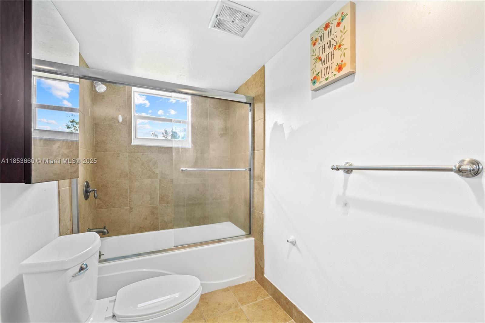 4088 Inverrary Drive, Unit 11F Lauderhill, FL 33319 - Photo 21 of 34 a bathroom with a toilet and a shower