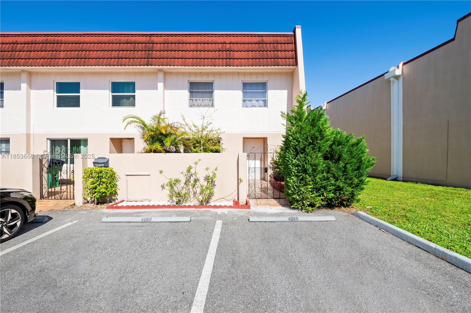 4088 Inverrary Drive, Unit 11F Lauderhill, FL 33319 - Photo 3 of 34 a front view of a house with a yard and garage