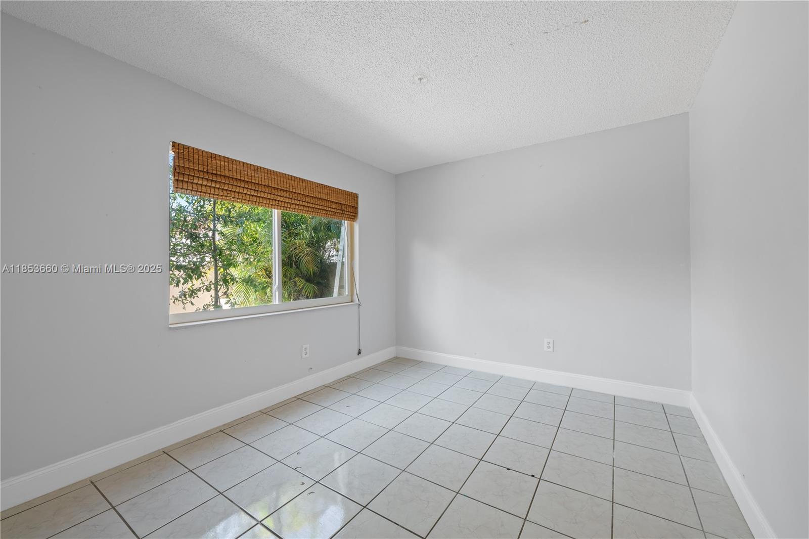 4088 Inverrary Drive, Unit 11F Lauderhill, FL 33319 - Photo 10 of 34 a view of an empty room and window