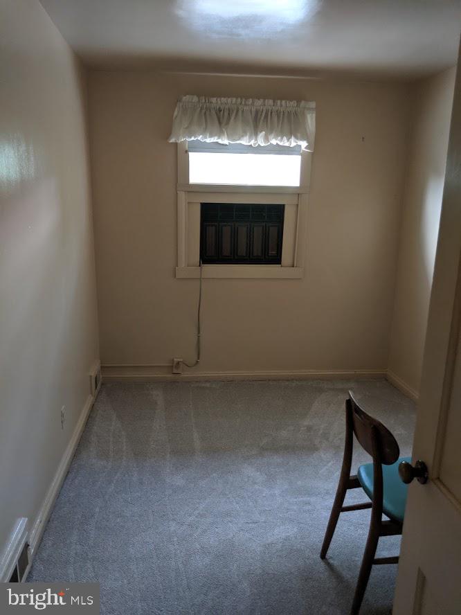 1800 Burnwood Road Baltimore, MD 21239 - Photo 15 of 27 3rd bedroom Hardwood under carpet