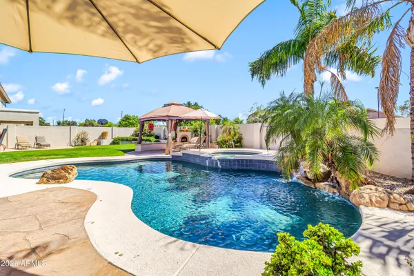 a view of a swimming pool with a patio