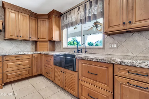 a living room with furniture wooden floor and a fireplace