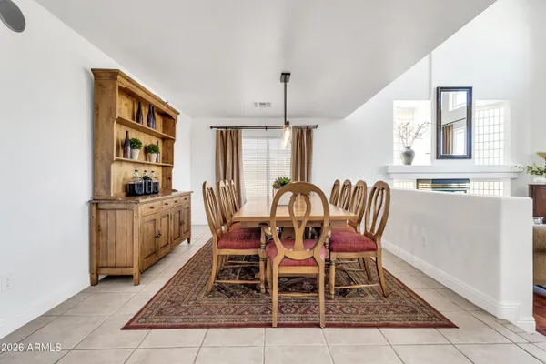 a large white kitchen with a sink
