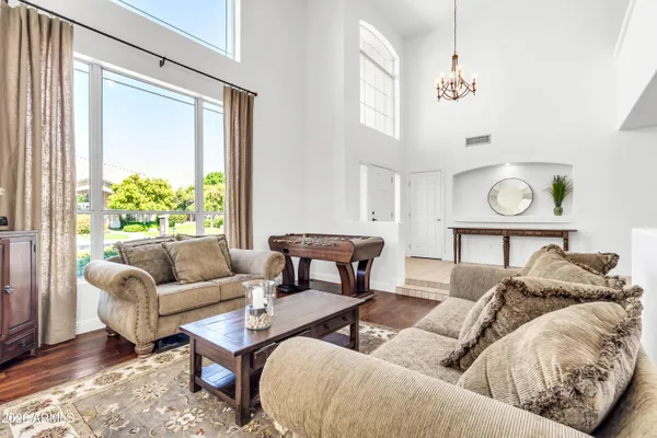 a bathroom with a sink a mirror and a potted plant