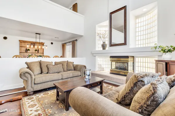 a large white kitchen with a refrigerator a sink and a cabinets