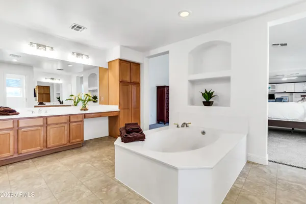 a room with pool table and wooden floor