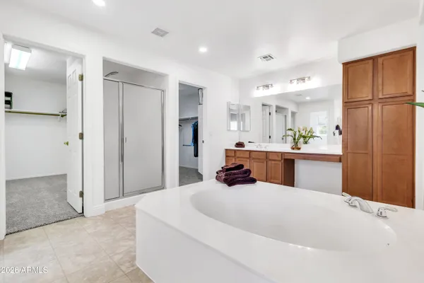 a bedroom with a bed dresser and a window