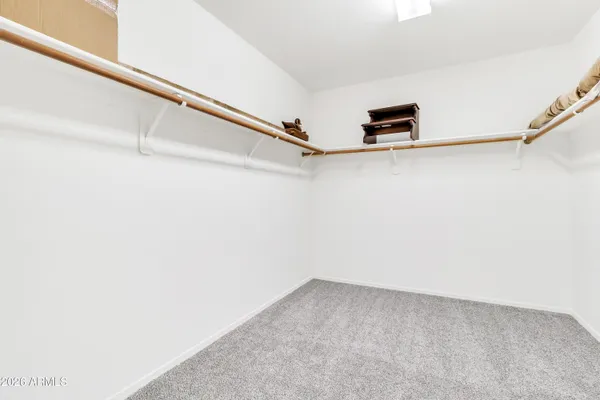 a view of a house with swimming pool and sitting area