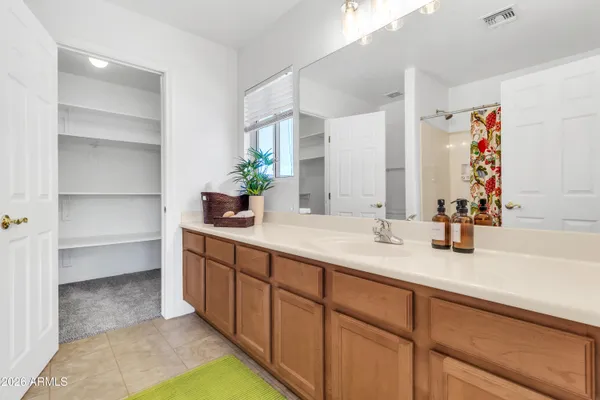 a view of a patio with table and chairs with wooden floor and plants