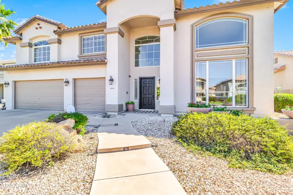 a kitchen with stainless steel appliances granite countertop a stove a sink dishwasher and cabinets with wooden floor