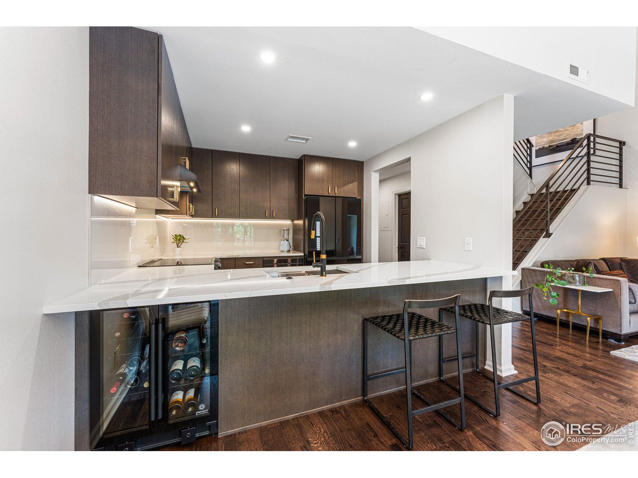 4475 Laguna Place, Unit 309 Boulder, CO 80303 - Photo 8 of 38 Breakfast bar seating with wine refrigerator