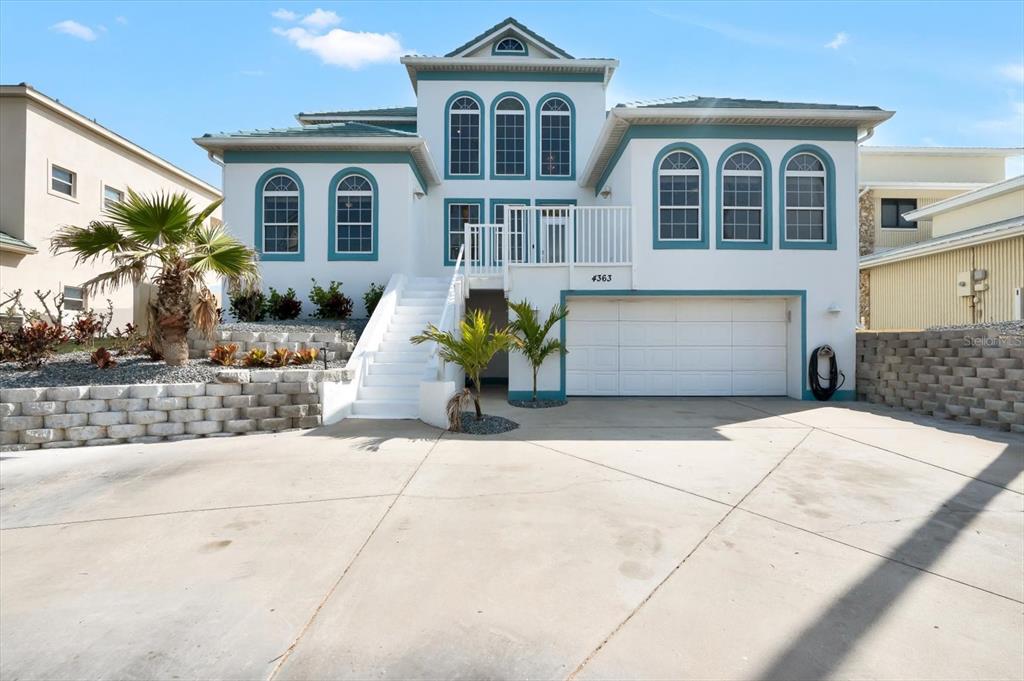 4363 South Atlantic Avenue Ponce Inlet, FL 32127 - Photo 1 of 46 a front view of a house with a yard