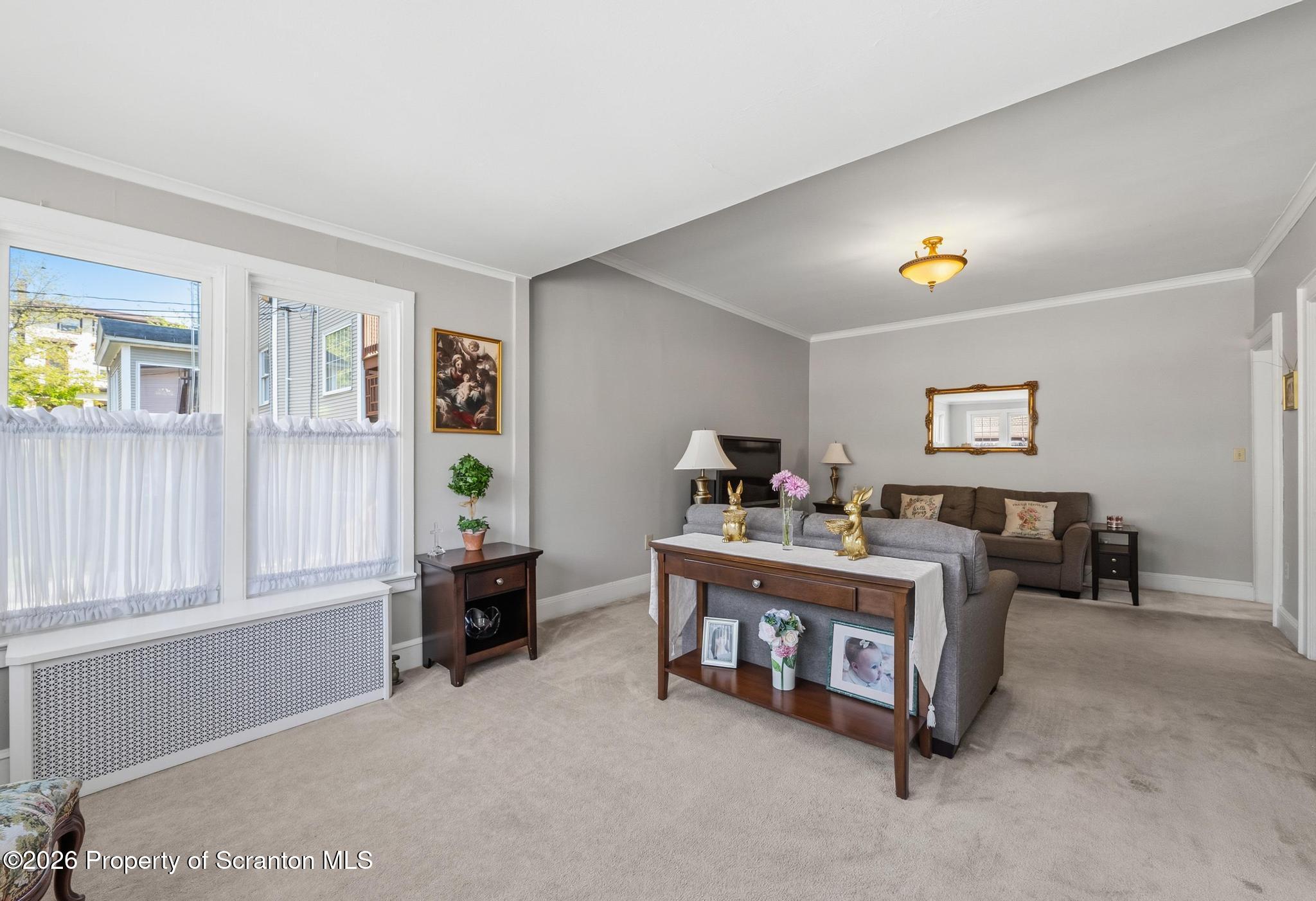616 Myrtle Street Scranton, PA 18510 - Photo 10 of 65 a living room with furniture and a window
