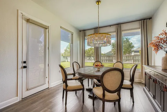 a dining room with furniture window wooden floor