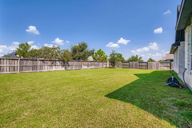 a view of yard with swimming pool and outdoor seating