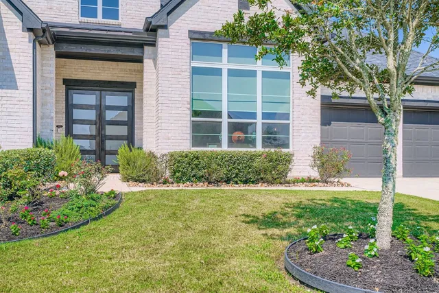 a view of a house with a garden