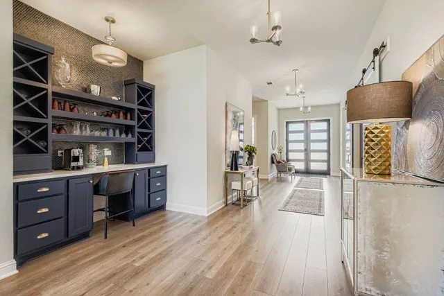 a view of a center island and wooden floor