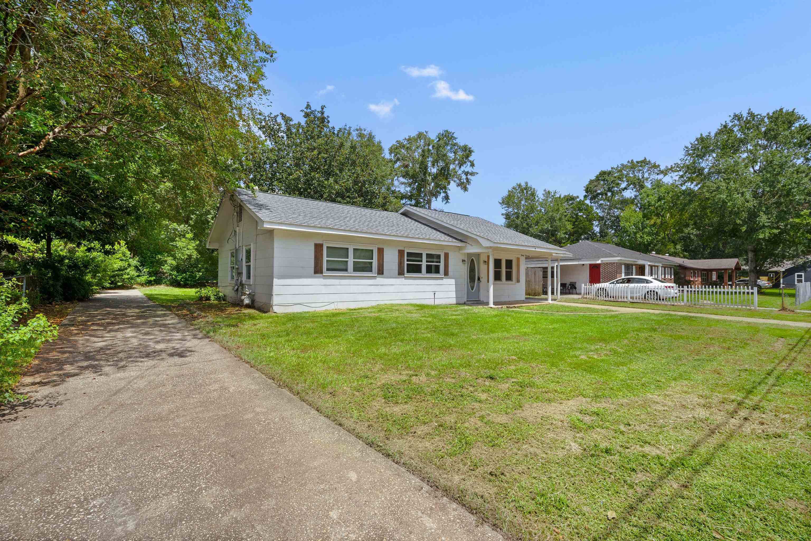 3014 Farcott Street Mobile, AL 36606 - Photo 3 of 26 Ranch-style house featuring roof with shingles and driveway