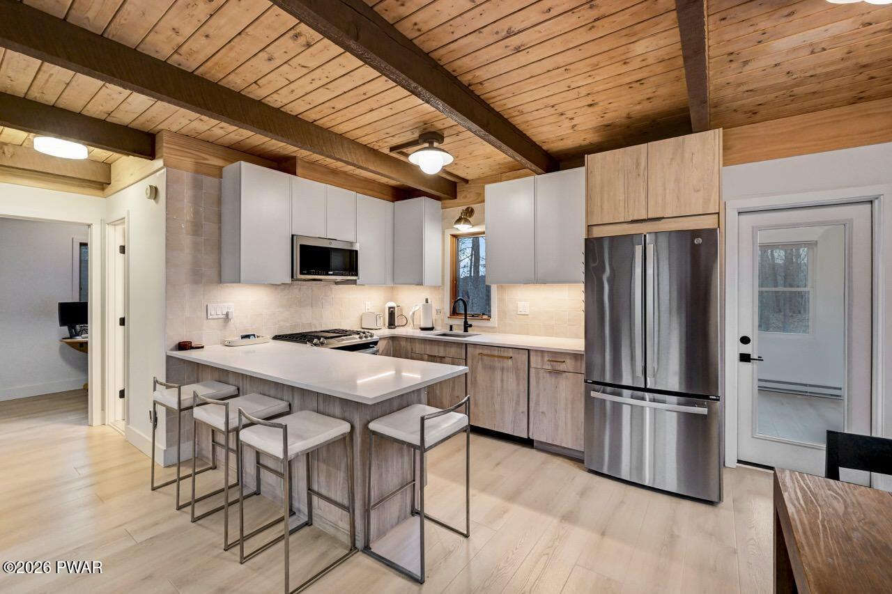 258 Lakeview Road Lackawaxen, PA 18435 - Photo 2 of 119 a kitchen with stainless steel appliances a refrigerator a stove a sink dishwasher and a refrigerator