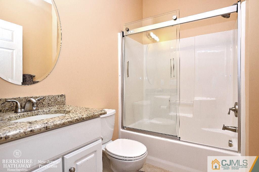 40 Edgewood Road Edison, NJ 08820 - Photo 15 of 25 a bathroom with a granite countertop sink toilet and shower