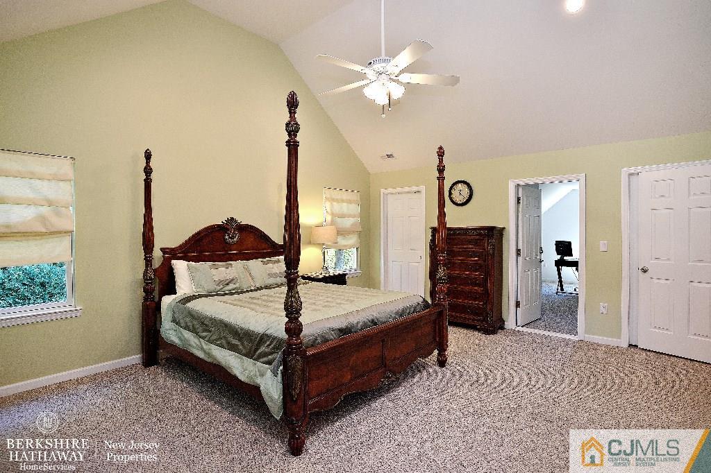40 Edgewood Road Edison, NJ 08820 - Photo 17 of 25 a bedroom with a bed a chandelier and a dresser