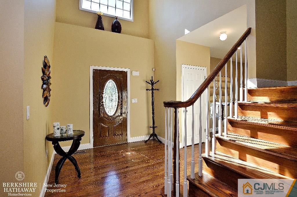 40 Edgewood Road Edison, NJ 08820 - Photo 3 of 25 a view of staircase with wooden floor and a potted plant