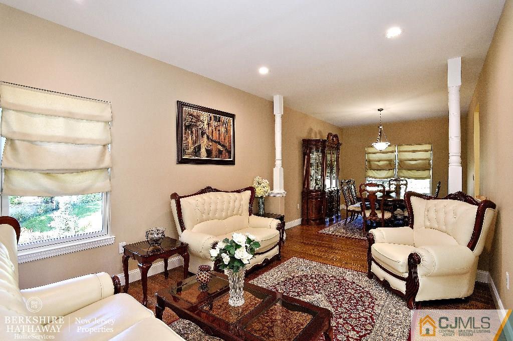 40 Edgewood Road Edison, NJ 08820 - Photo 4 of 25 a living room with furniture and a large window