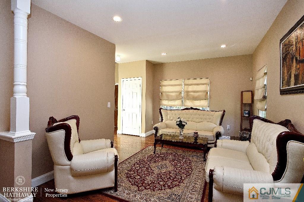 40 Edgewood Road Edison, NJ 08820 - Photo 5 of 25 a living room with furniture or couch and a potted plant
