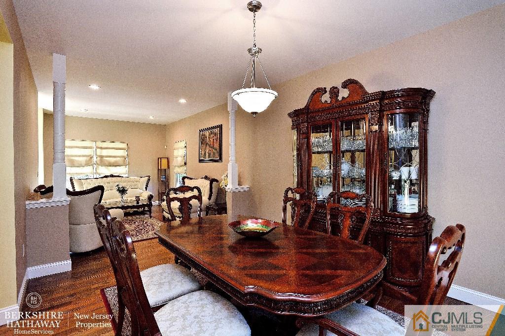40 Edgewood Road Edison, NJ 08820 - Photo 7 of 25 a dining room with furniture a chandelier and window