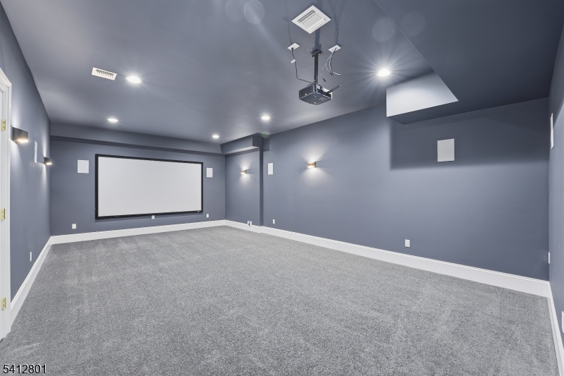 2 Heather Lane Scotch Plains, NJ 07076 - Photo 15 of 17 an empty room with projector and hallway