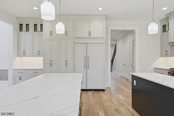 a view of kitchen and wooden floor