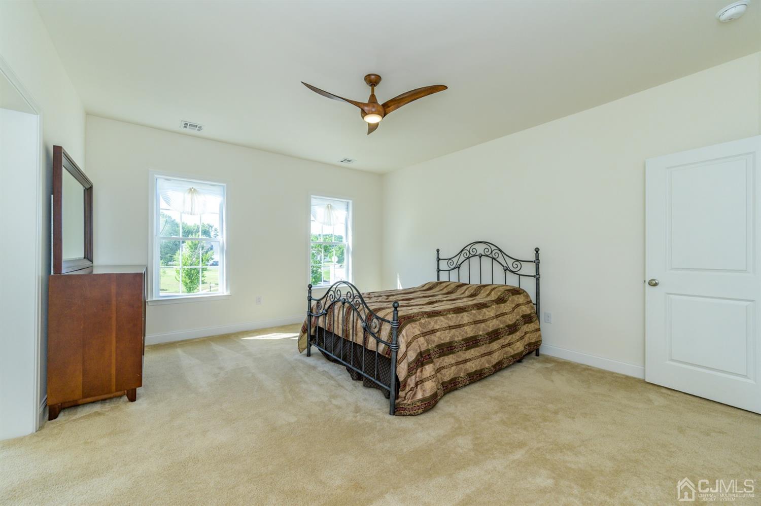 8 Harness Court Cream Ridge, NJ 08514 - Photo 22 of 47 a spacious bedroom with a bed and window