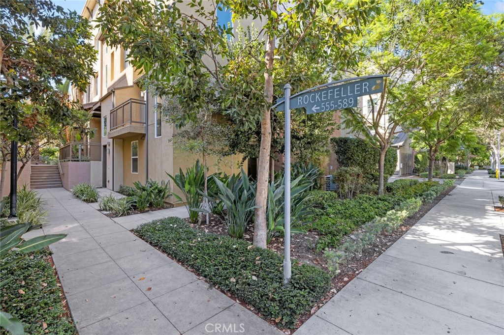 561 Rockefeller Irvine, CA 92612 - Photo 18 of 26 a front view of a house with garden