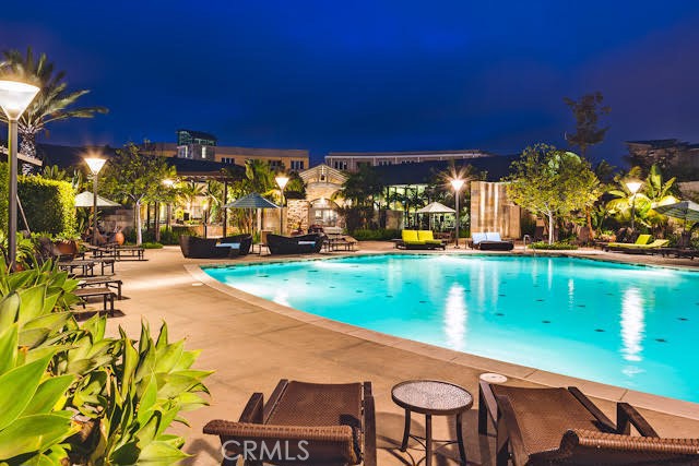 561 Rockefeller Irvine, CA 92612 - Photo 21 of 26 a view of a patio with table and chairs potted plants with wooden fence