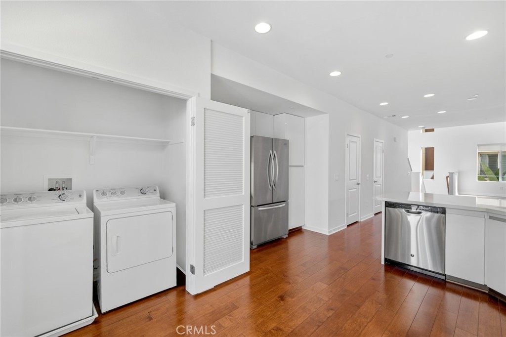 561 Rockefeller Irvine, CA 92612 - Photo 4 of 26 a view of storage and utility room with wooden floor