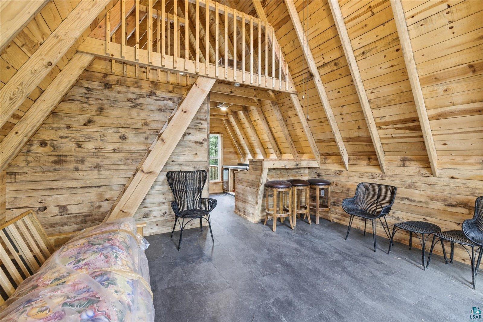 5298 Long Island Tower, MN 55790 - Photo 11 of 31 Vaulted wood-paneled ceiling with exposed beams