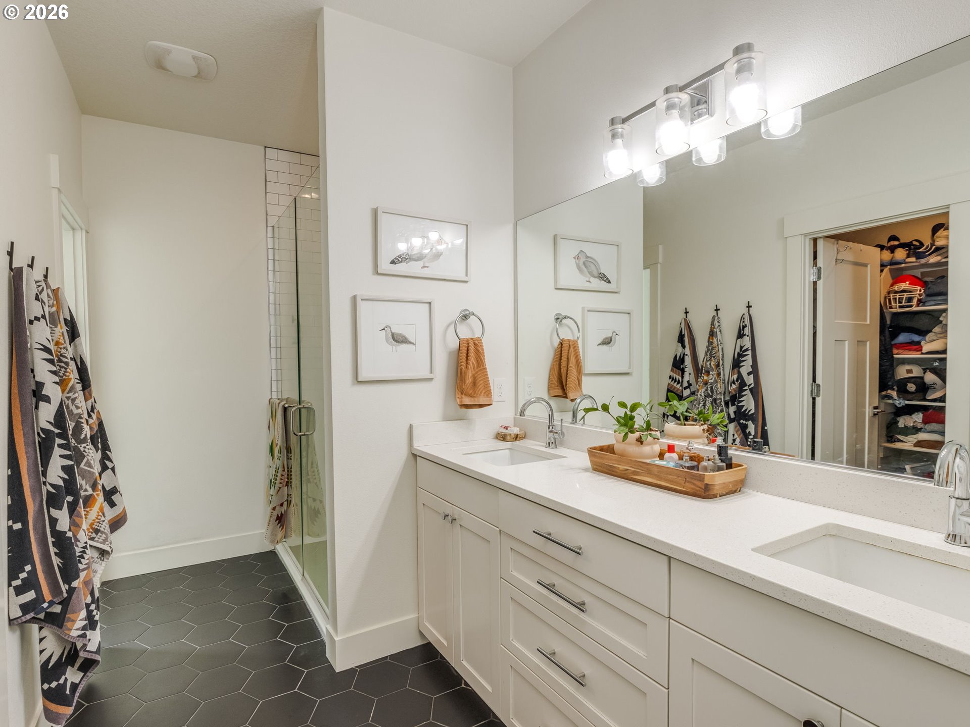 2893 4th Street Hubbard, OR 97032 - Photo 21 of 41 a bathroom with a sink a mirror and a shower