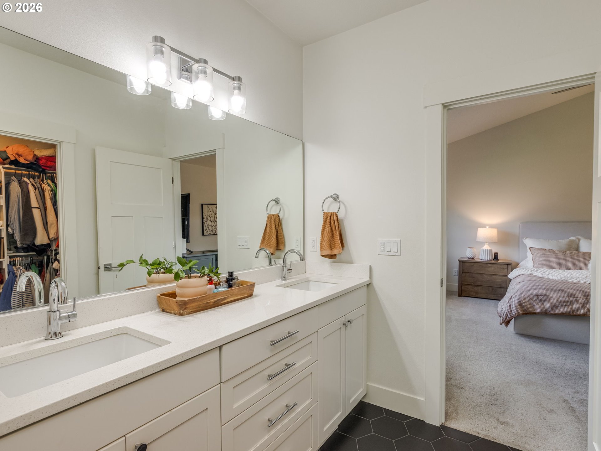 2893 4th Street Hubbard, OR 97032 - Photo 25 of 41 a en suite bathroom with double sink and a mirror