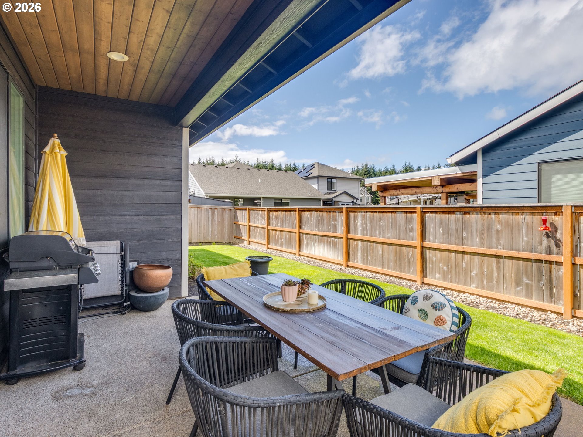 2893 4th Street Hubbard, OR 97032 - Photo 27 of 41 a view of a balcony with chairs and a patio